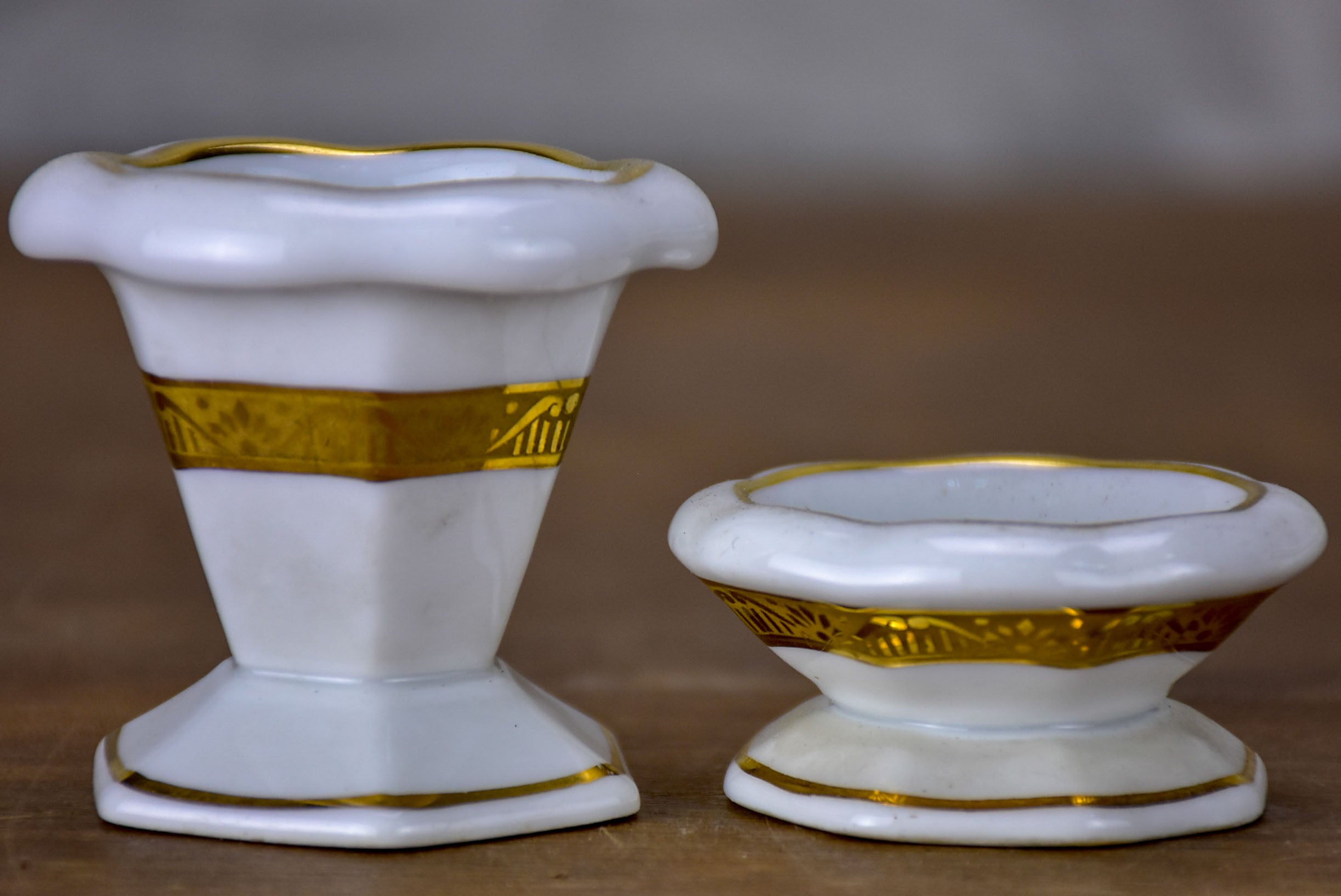 Antique French Limoges egg cups on a platter