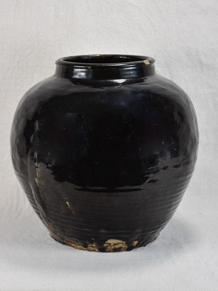 Large decorative antique pot with black glaze and ribbed base 14½"