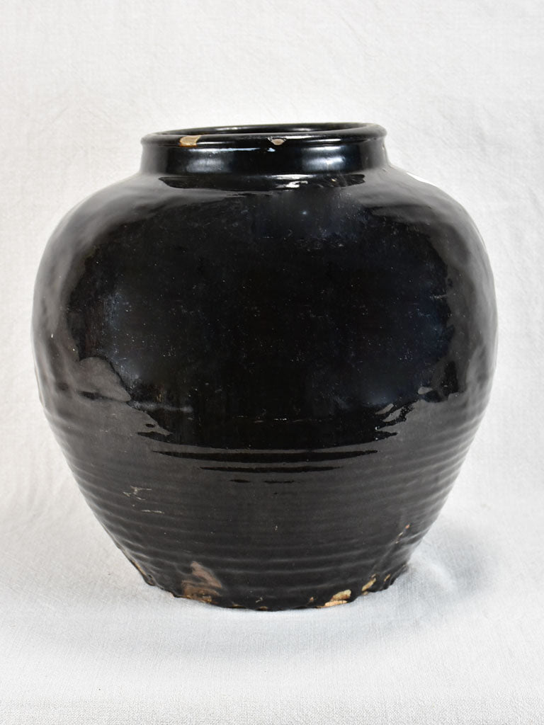 Large decorative antique pot with black glaze and ribbed base 14½"