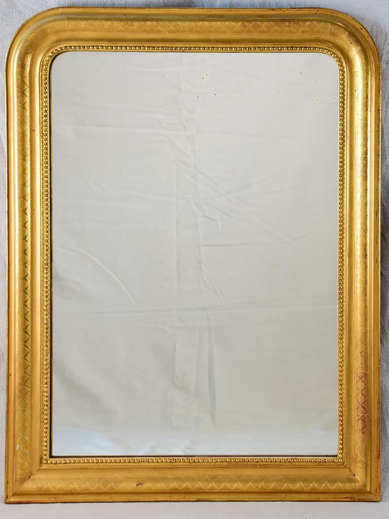 19th century Louis Philippe mirror with gilt frame and running pearl 26¾" x 35½"