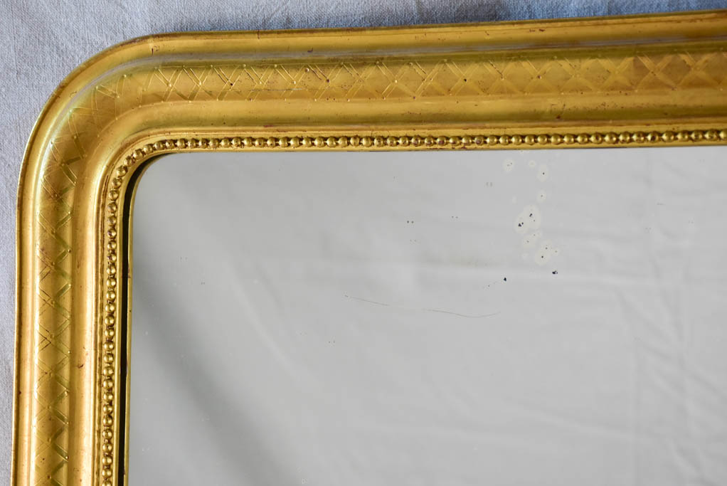 19th century Louis Philippe mirror with gilt frame and running pearl 26¾" x 35½"