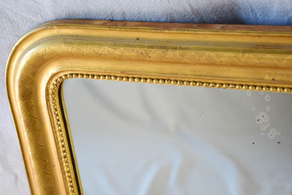 19th century Louis Philippe mirror with gilt frame and running pearl 26¾" x 35½"