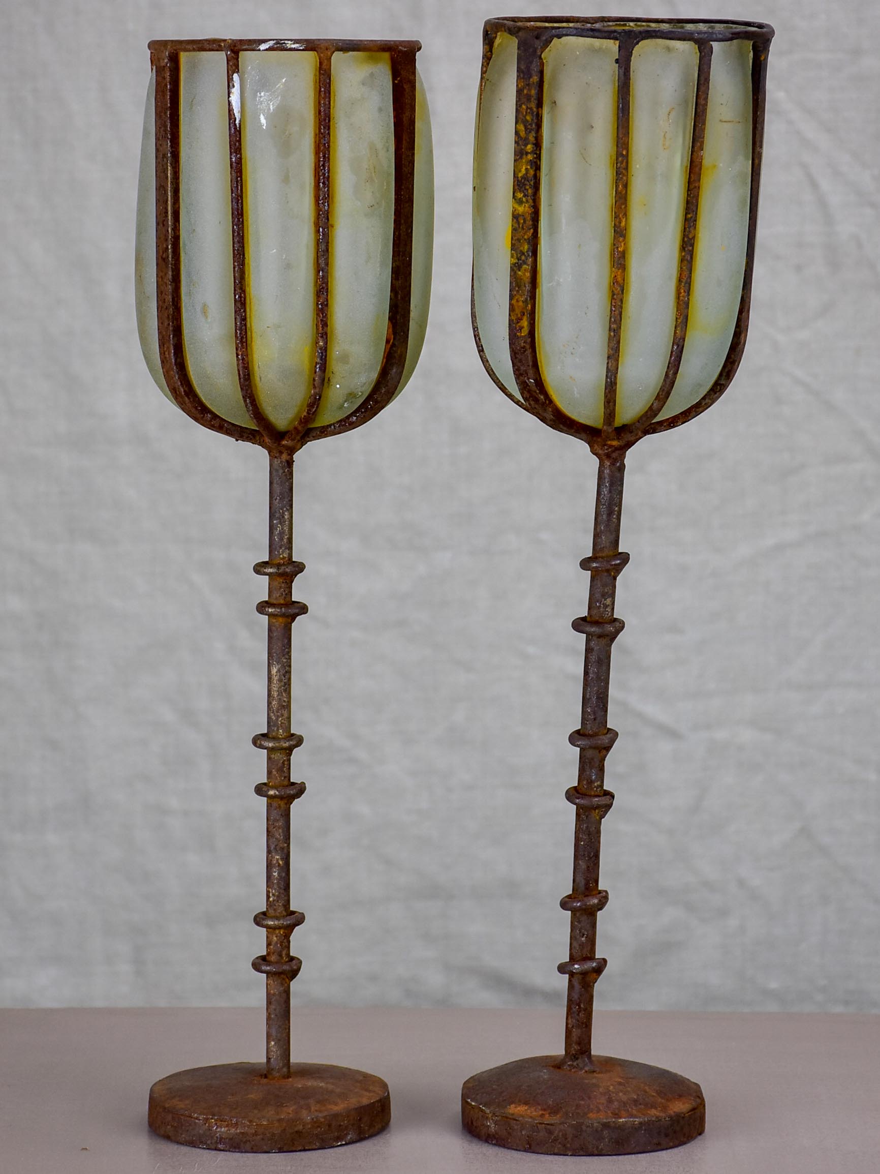 Two rustic glass and iron candlesticks - artisan made