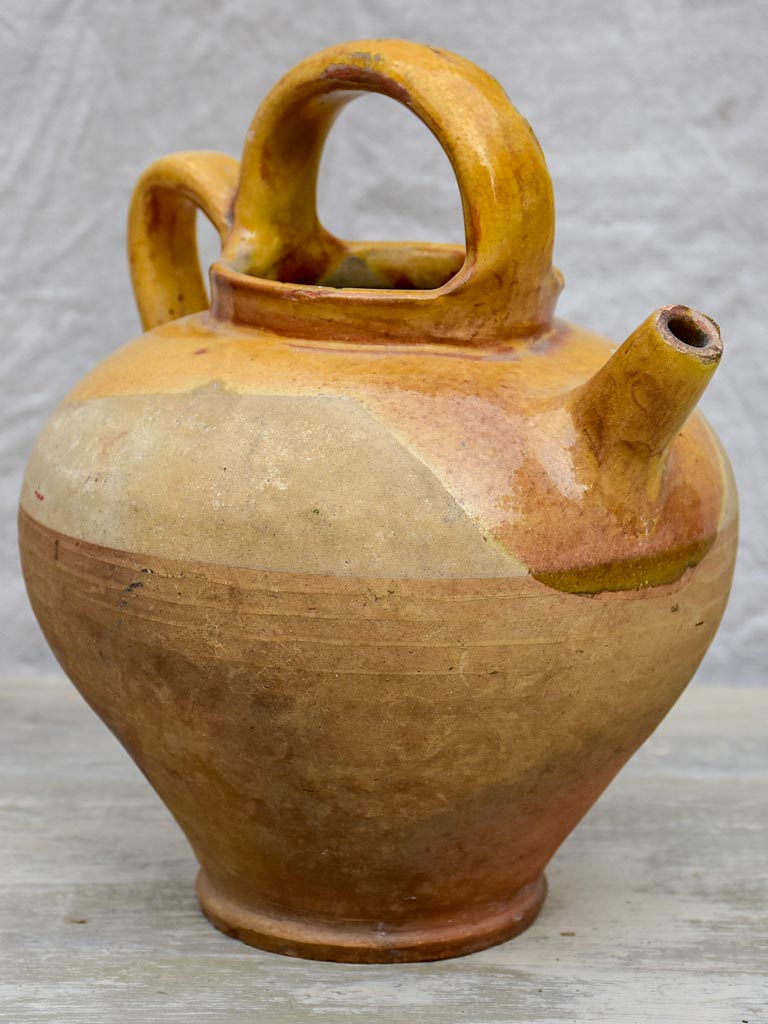 Antique French water pitcher with yellow glaze