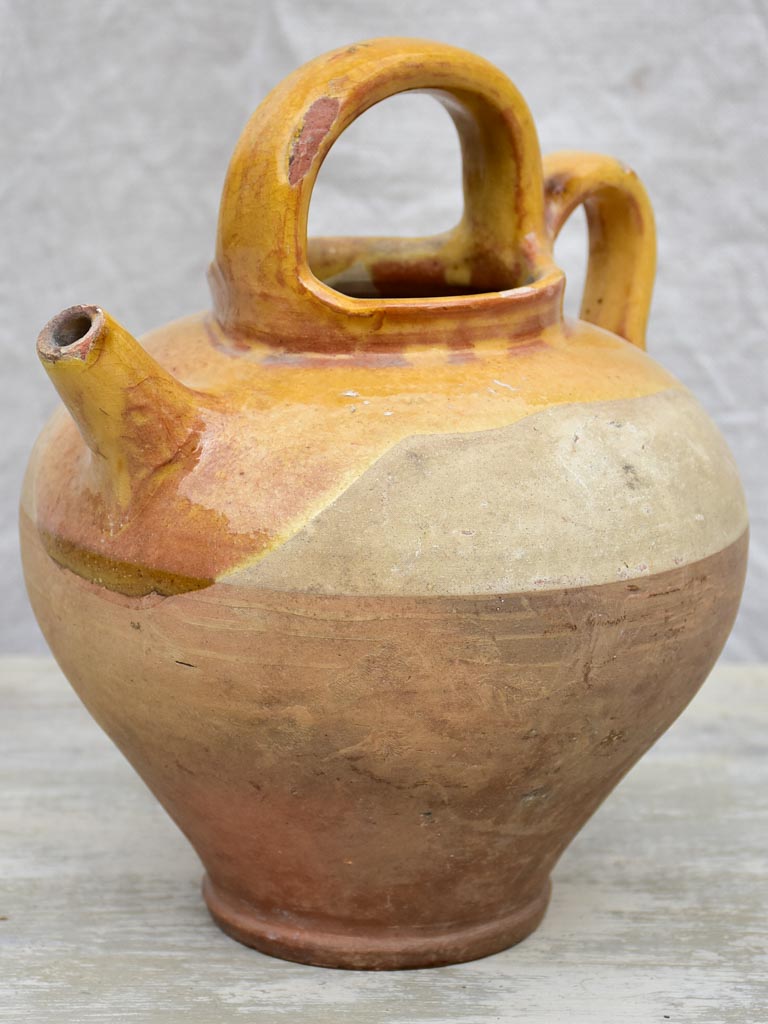 Antique French water pitcher with yellow glaze