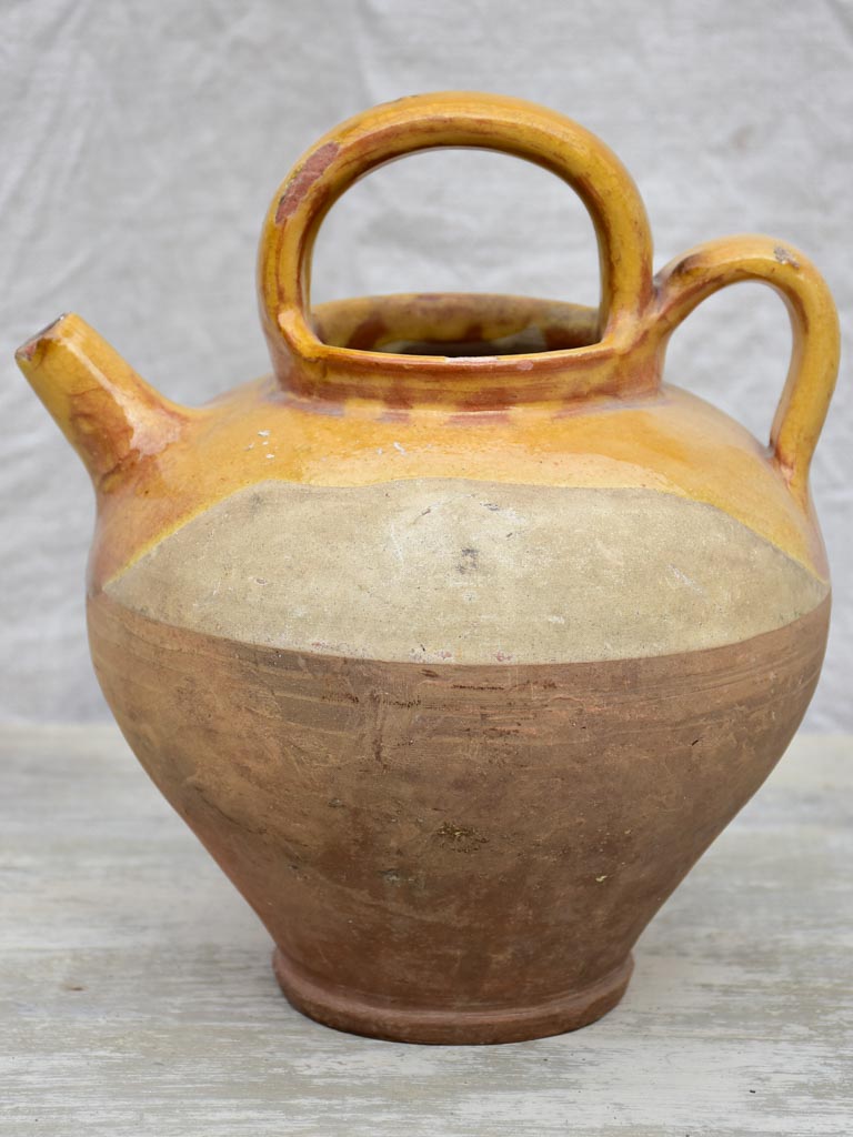 Antique French water pitcher with yellow glaze