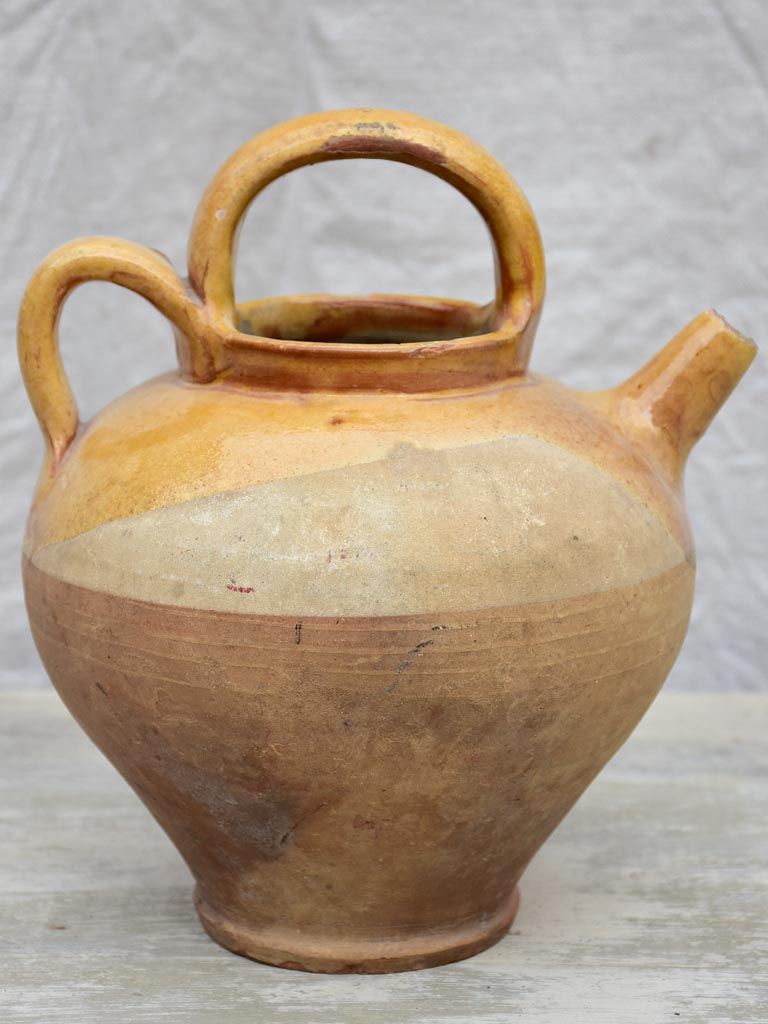 Antique French water pitcher with yellow glaze