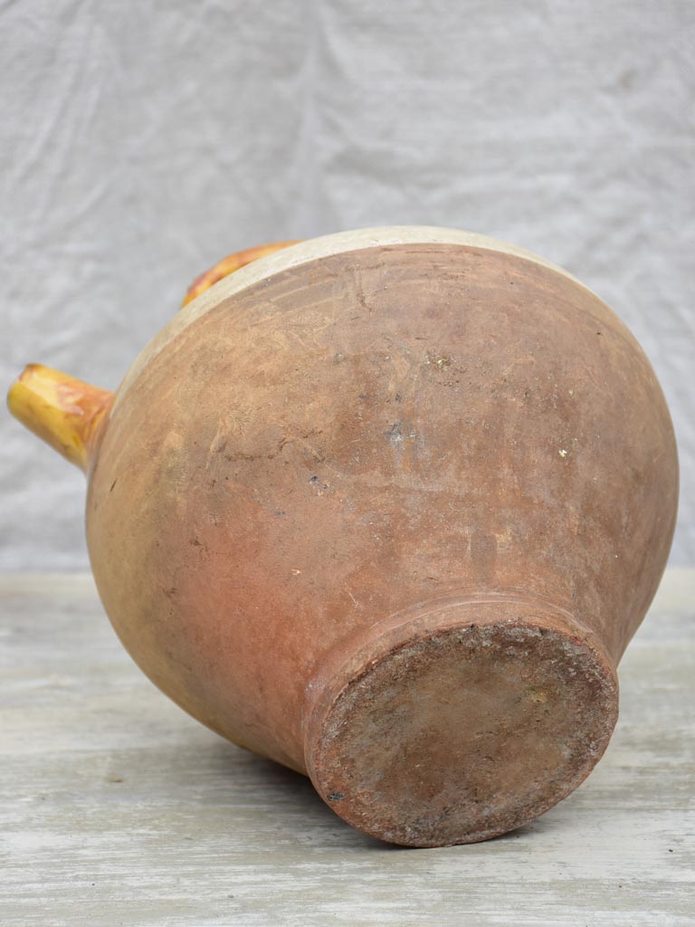 Antique French water pitcher with yellow glaze