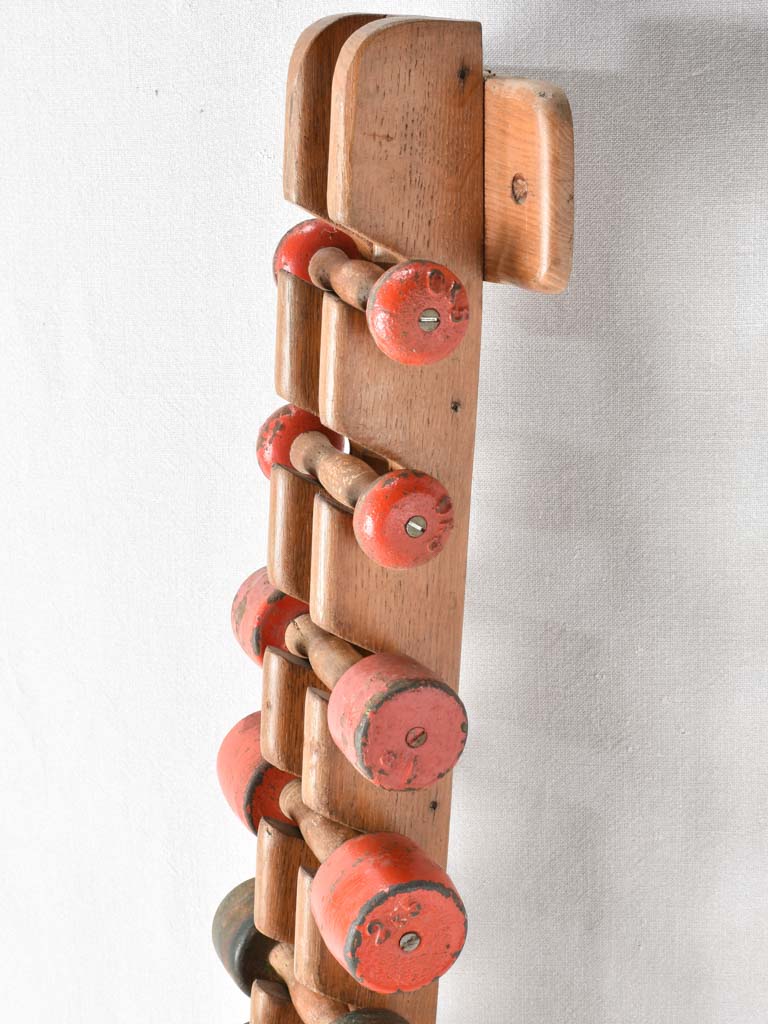 1950s gym weights in oak stand