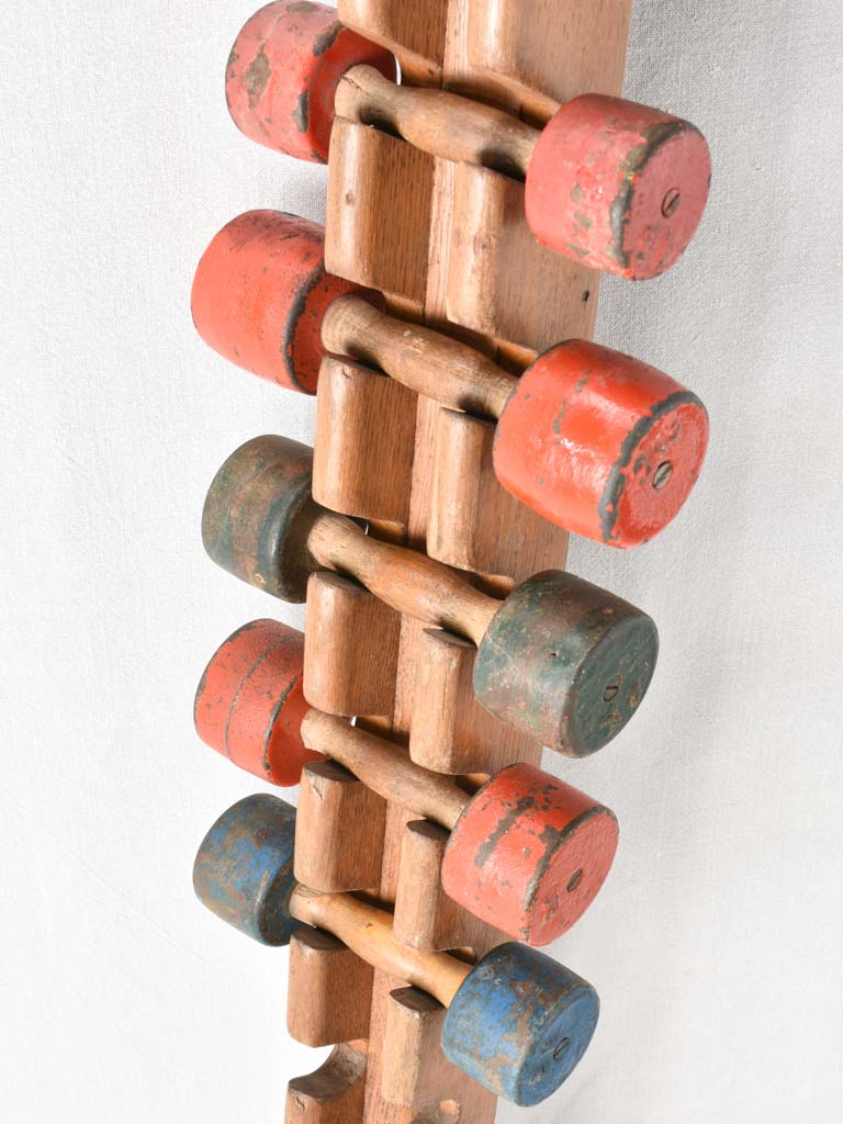 1950s gym weights in oak stand