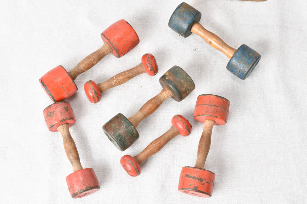 1950s gym weights in oak stand