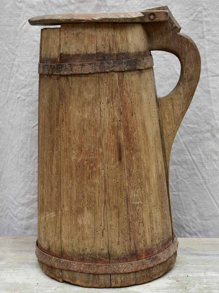 Primitive rustic wooden pitcher with lid