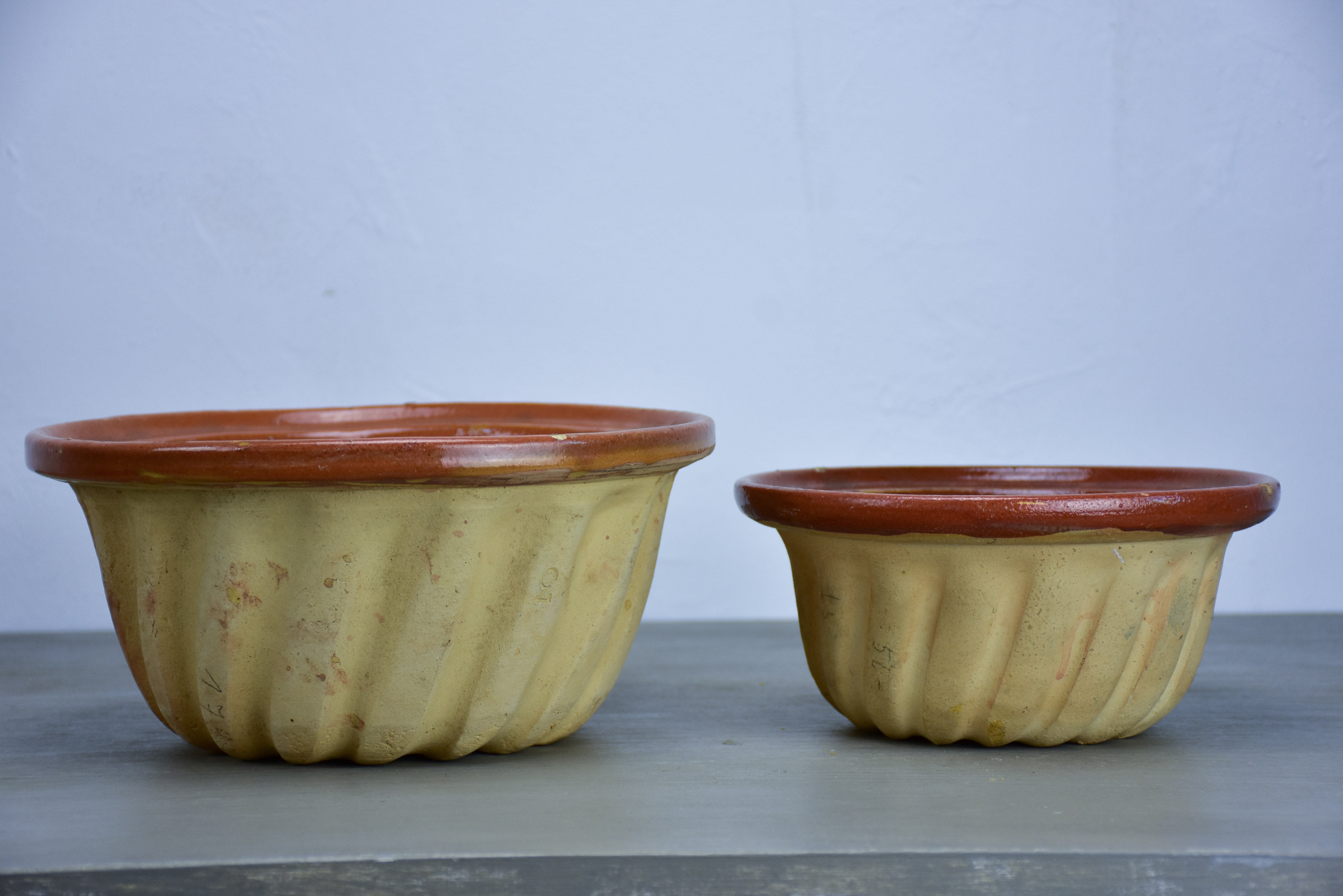 Two antique French terracotta Gugelhupf cake moulds