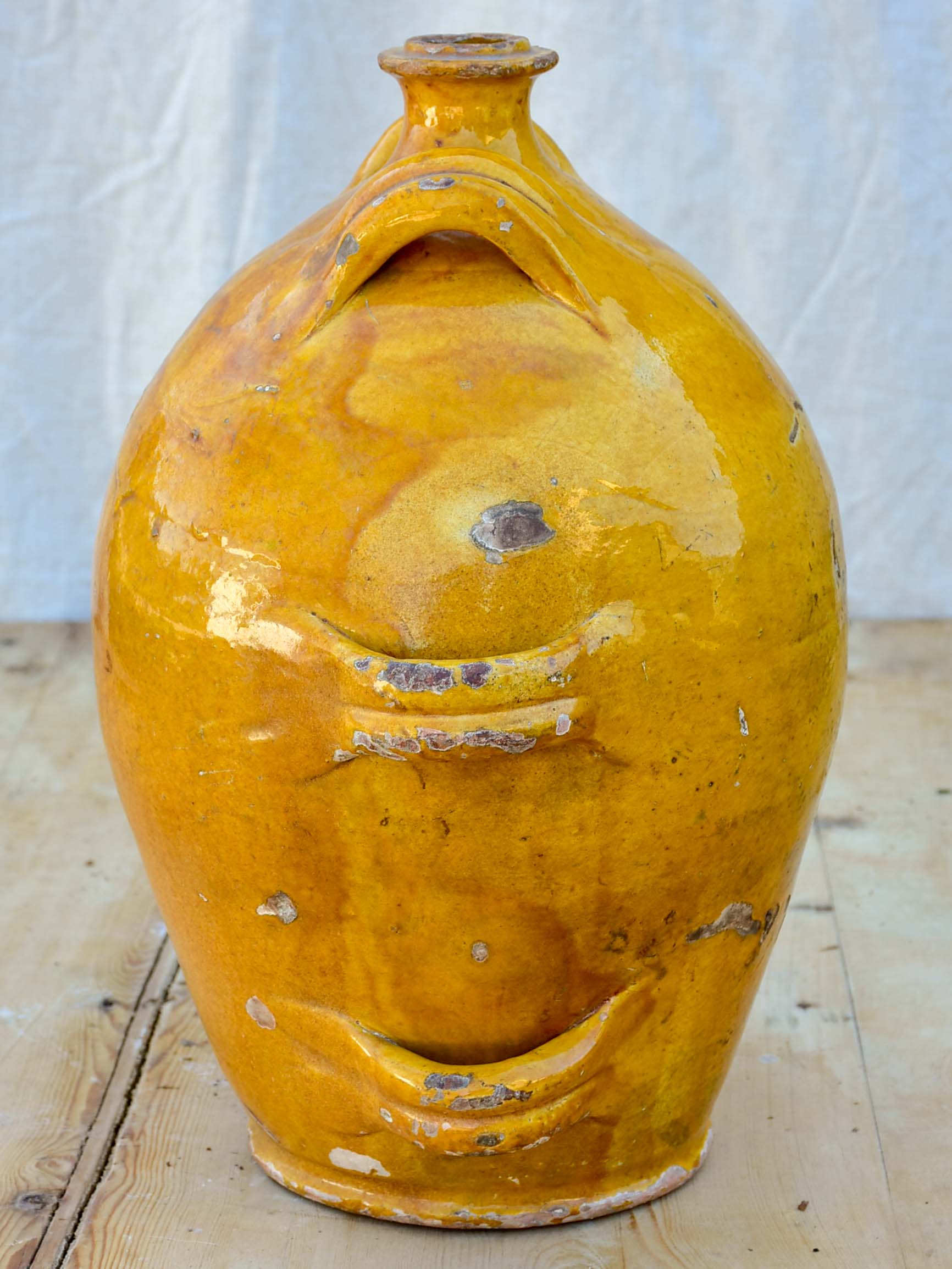 Antique French conscience water jug with yellow glaze