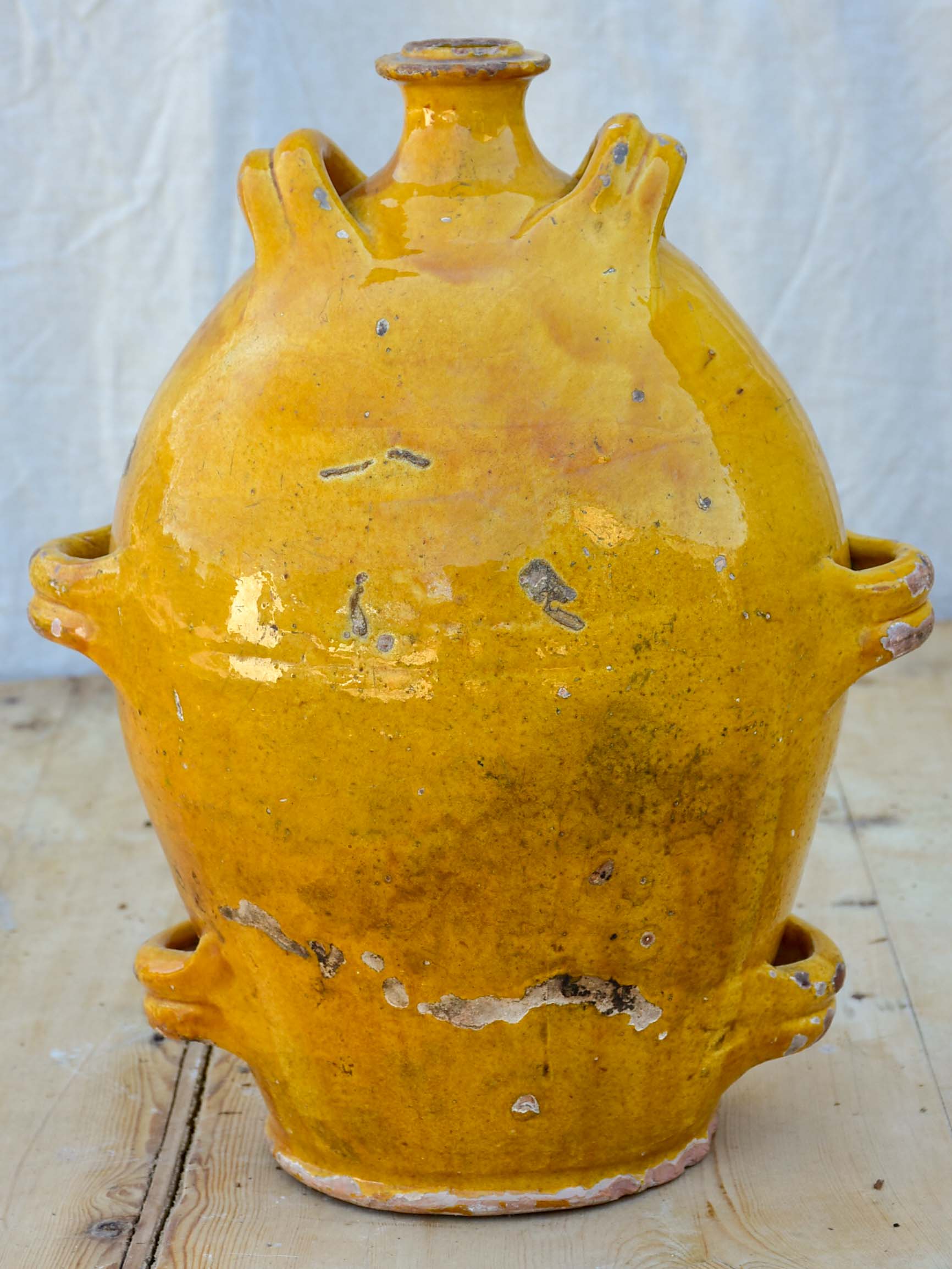 Antique French conscience water jug with yellow glaze