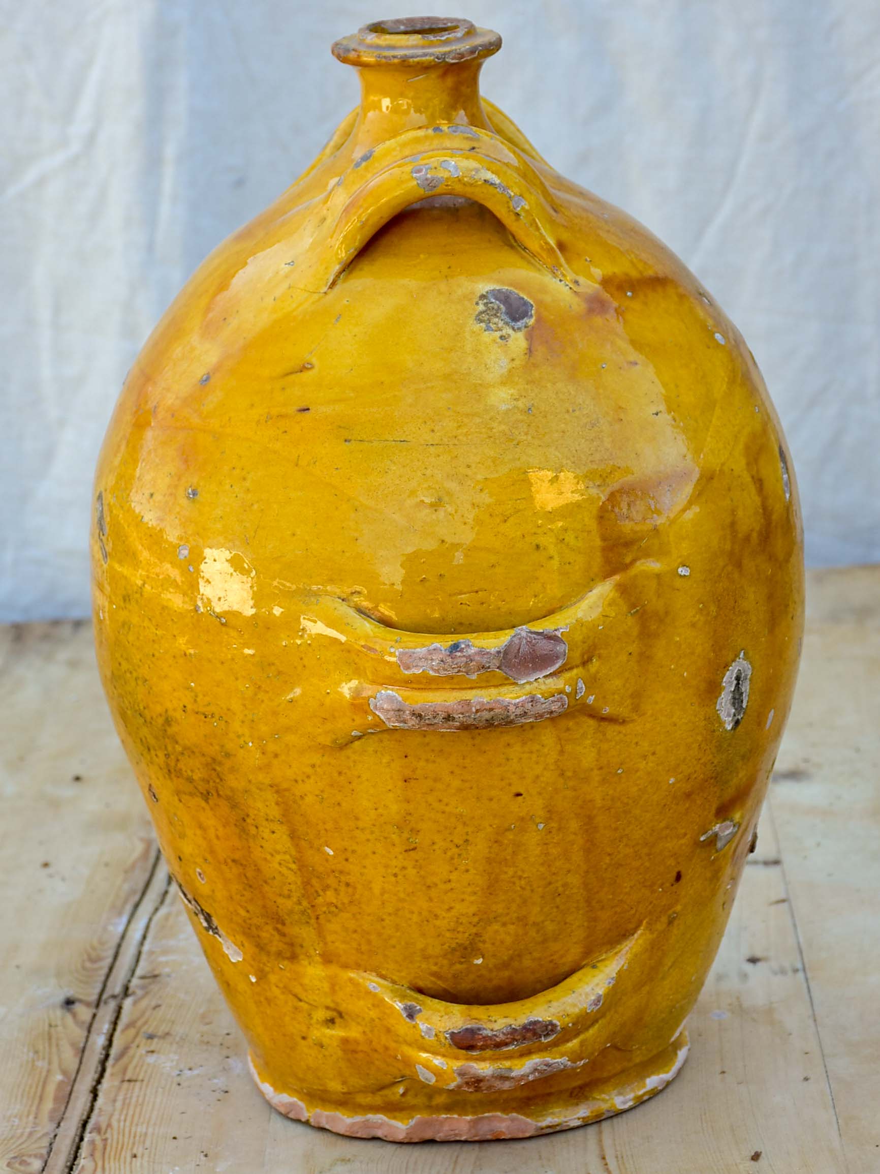 Antique French conscience water jug with yellow glaze