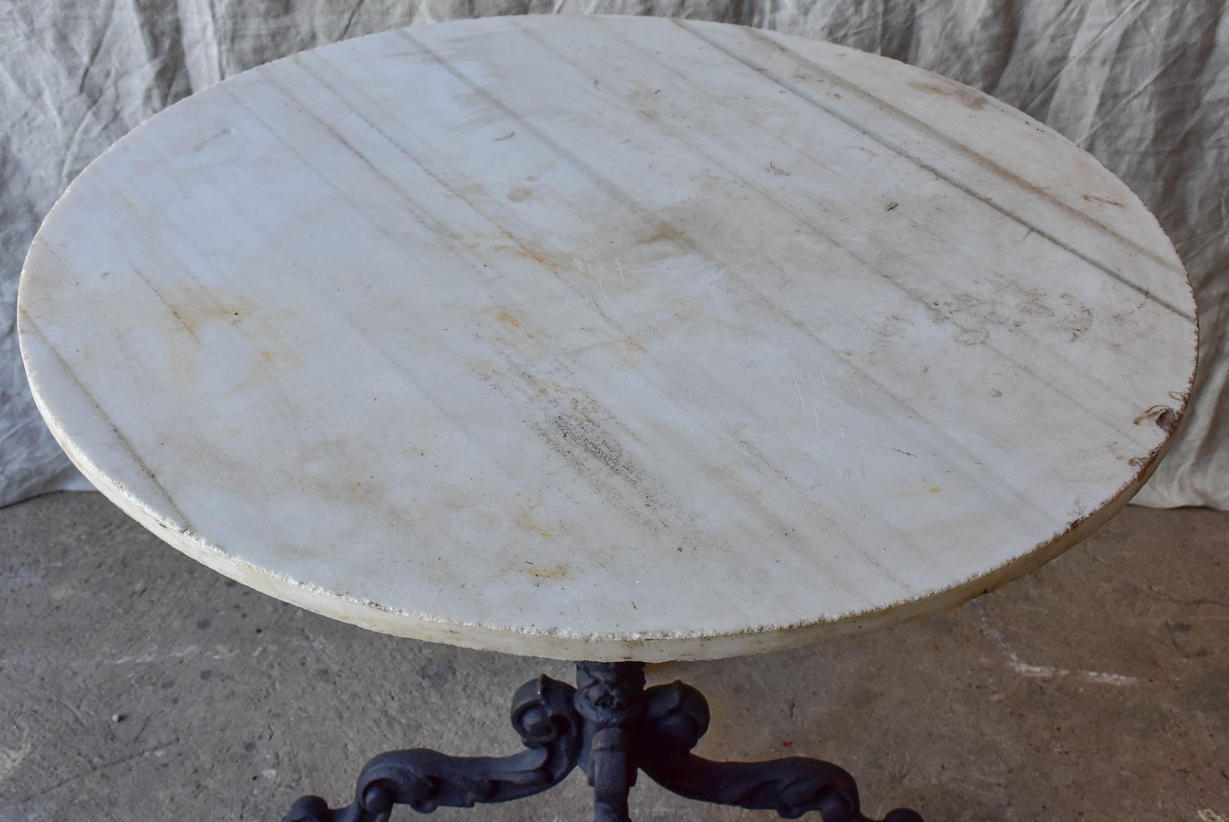 Round French garden table - black base, marble top