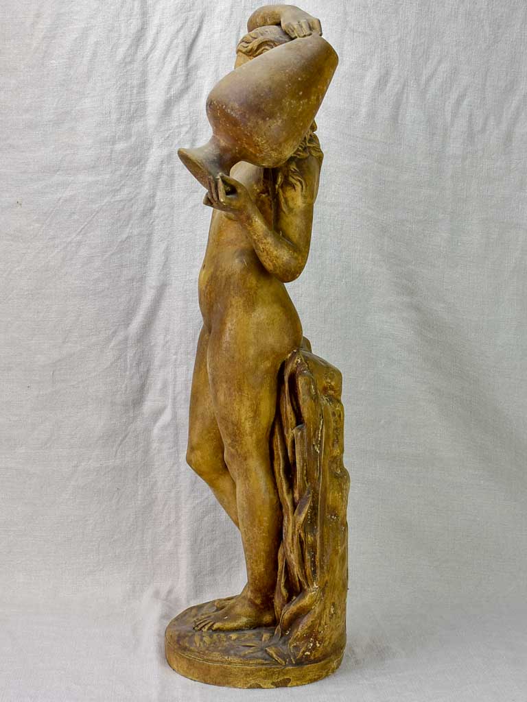 Antique terracotta sculpture of a woman holding a vase 29½"