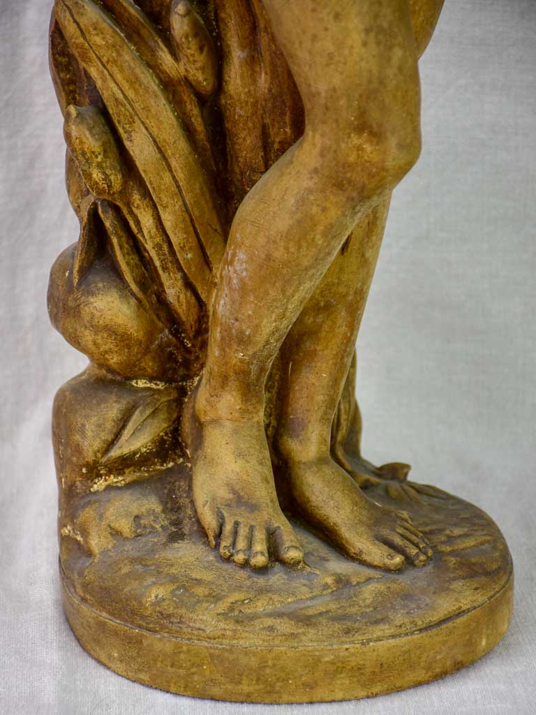 Antique terracotta sculpture of a woman holding a vase 29½"