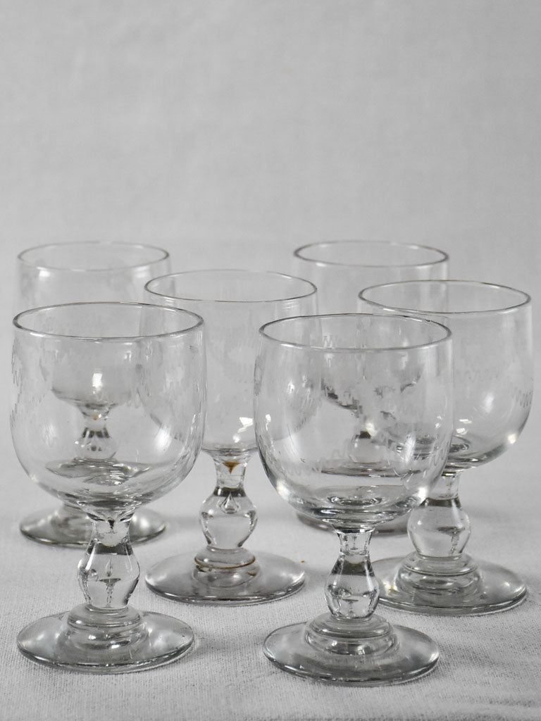 Six blown glass wine glasses with bow decoration