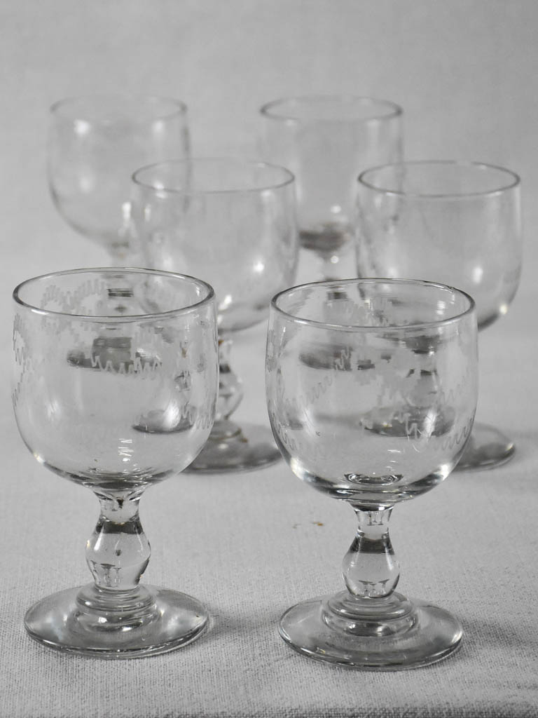 Six blown glass wine glasses with bow decoration