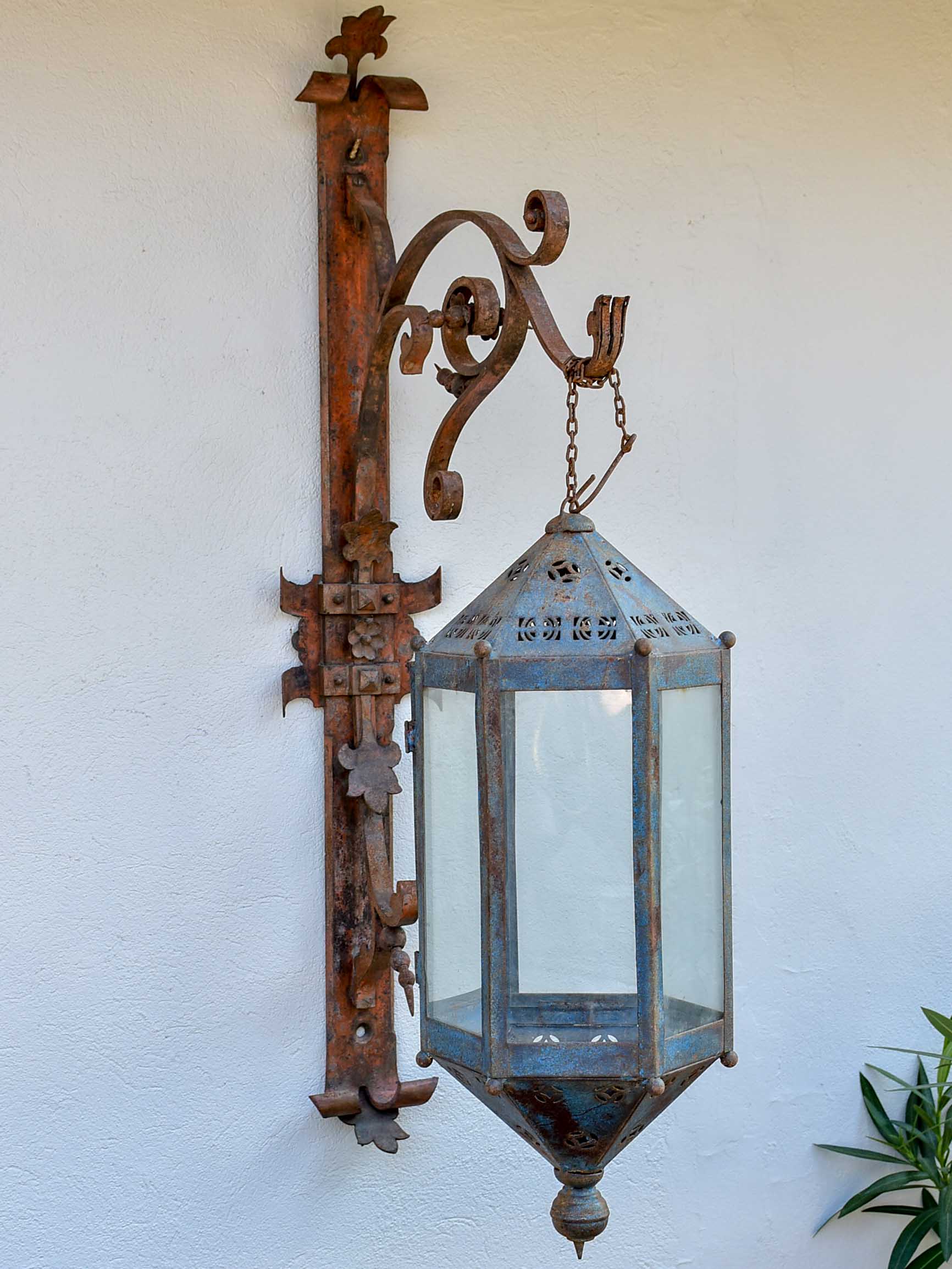 Antique lantern with large wrought iron wall bracket