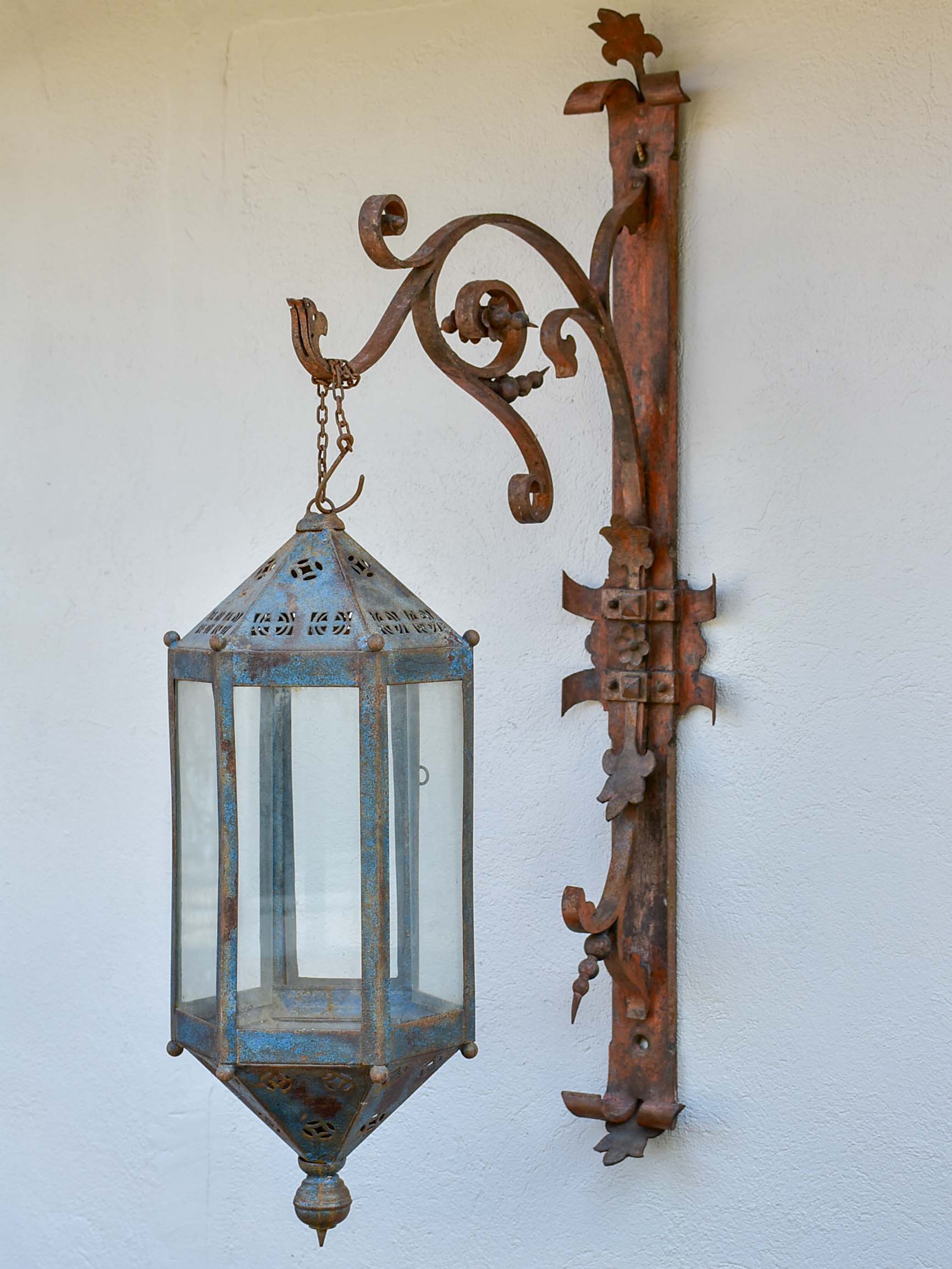 Antique lantern with large wrought iron wall bracket