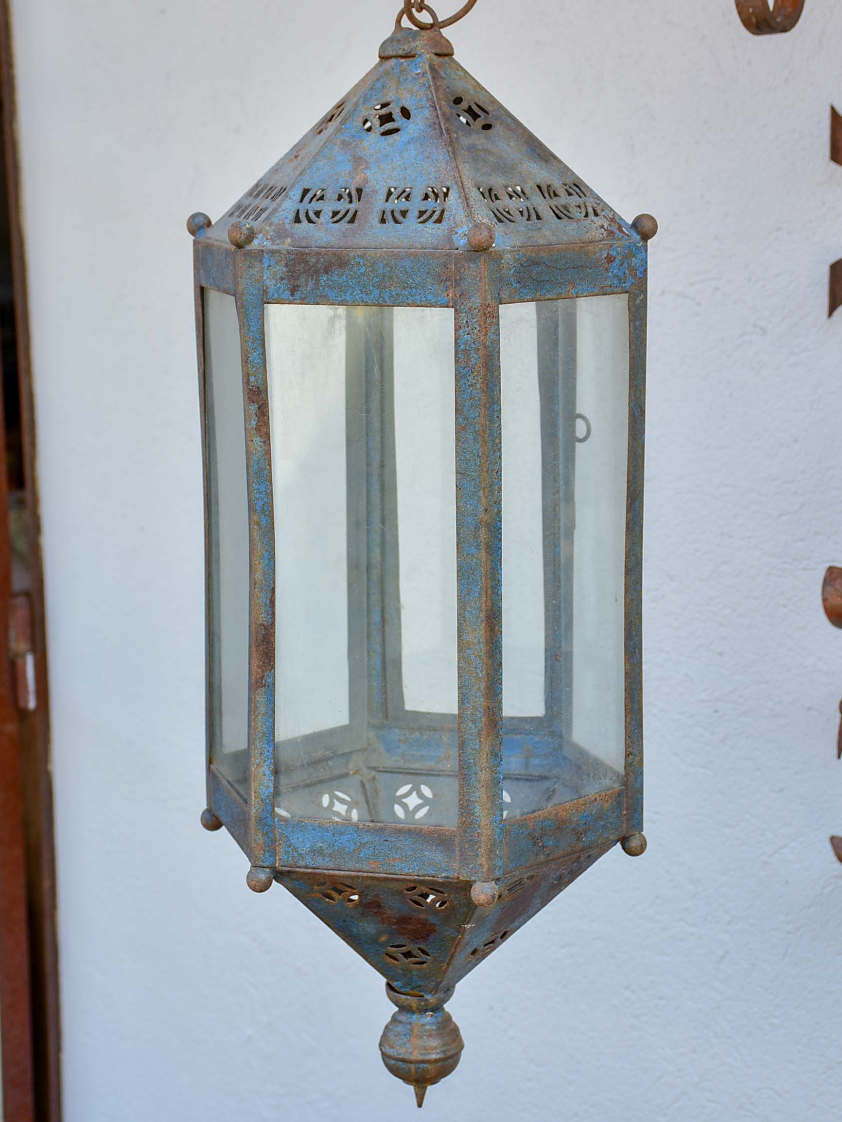 Antique lantern with large wrought iron wall bracket