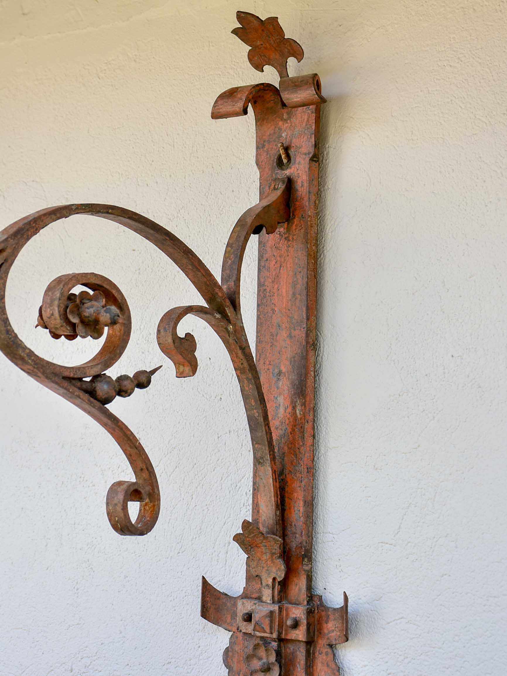 Antique lantern with large wrought iron wall bracket