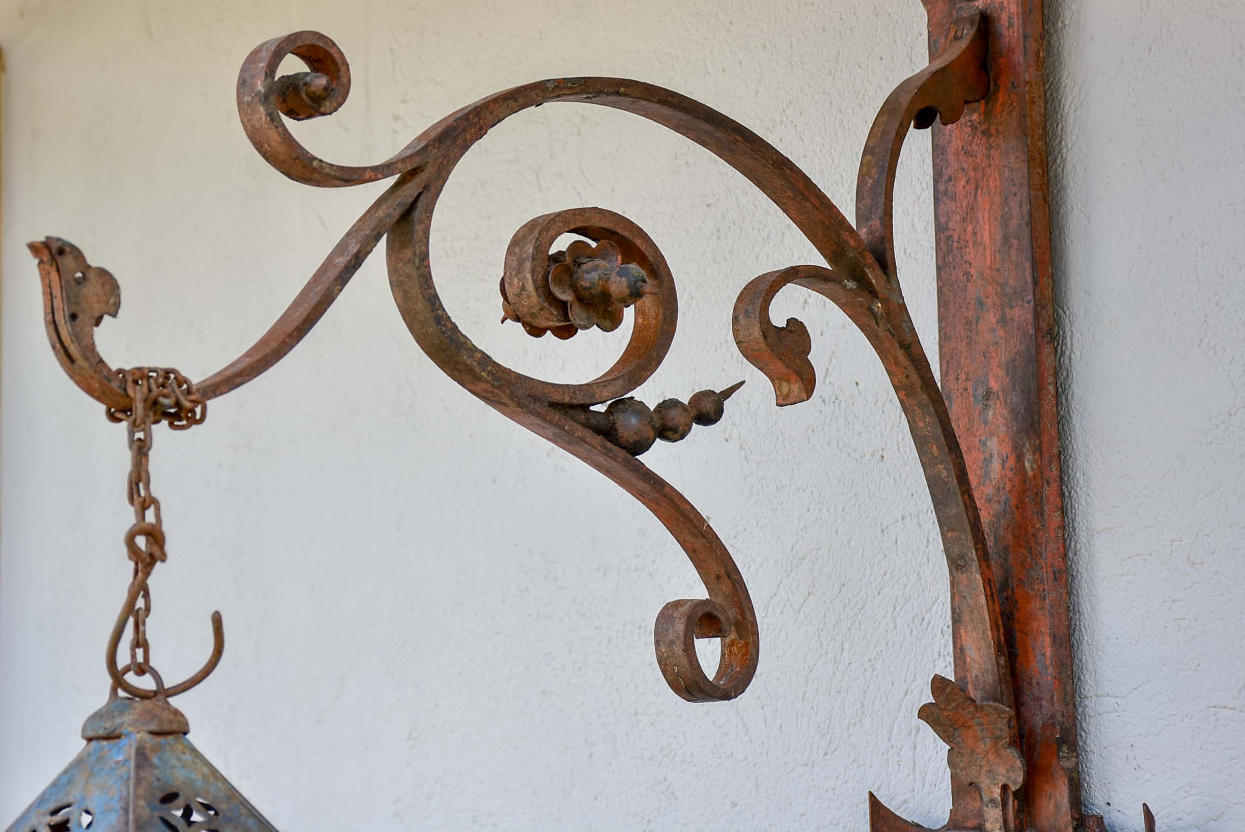 Antique lantern with large wrought iron wall bracket