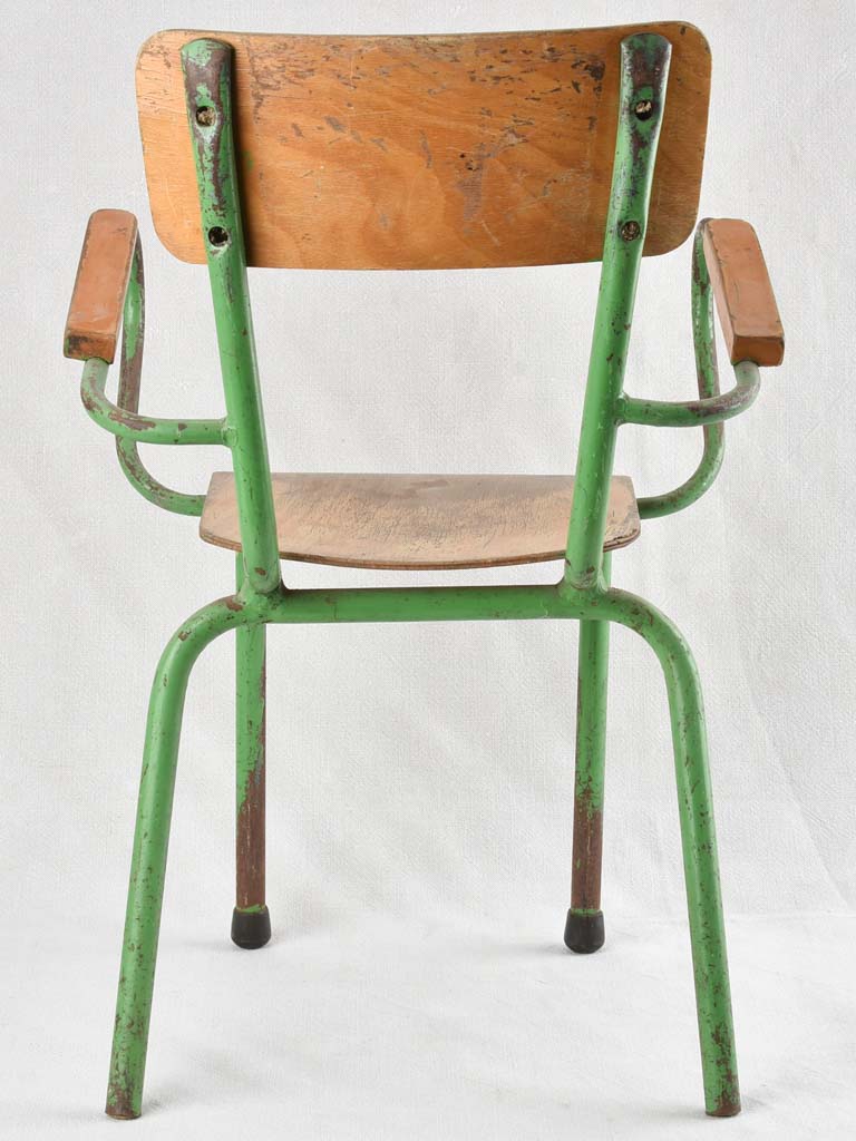 Vintage children's armchair with green patina