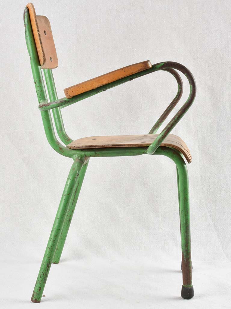 Vintage children's armchair with green patina