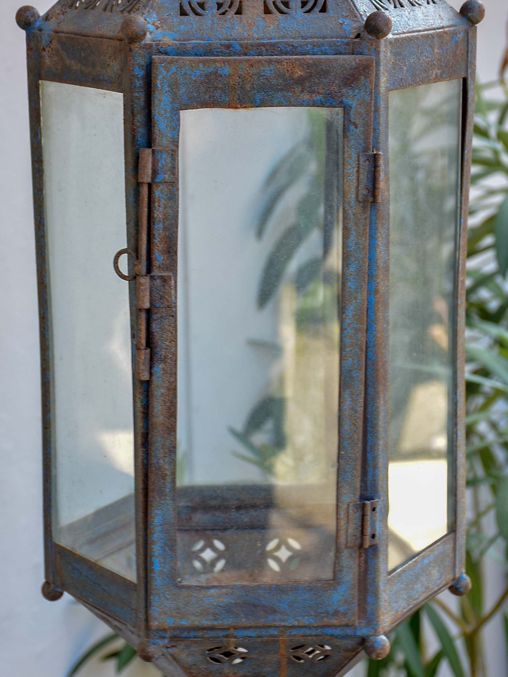 Antique lantern with large wrought iron wall bracket