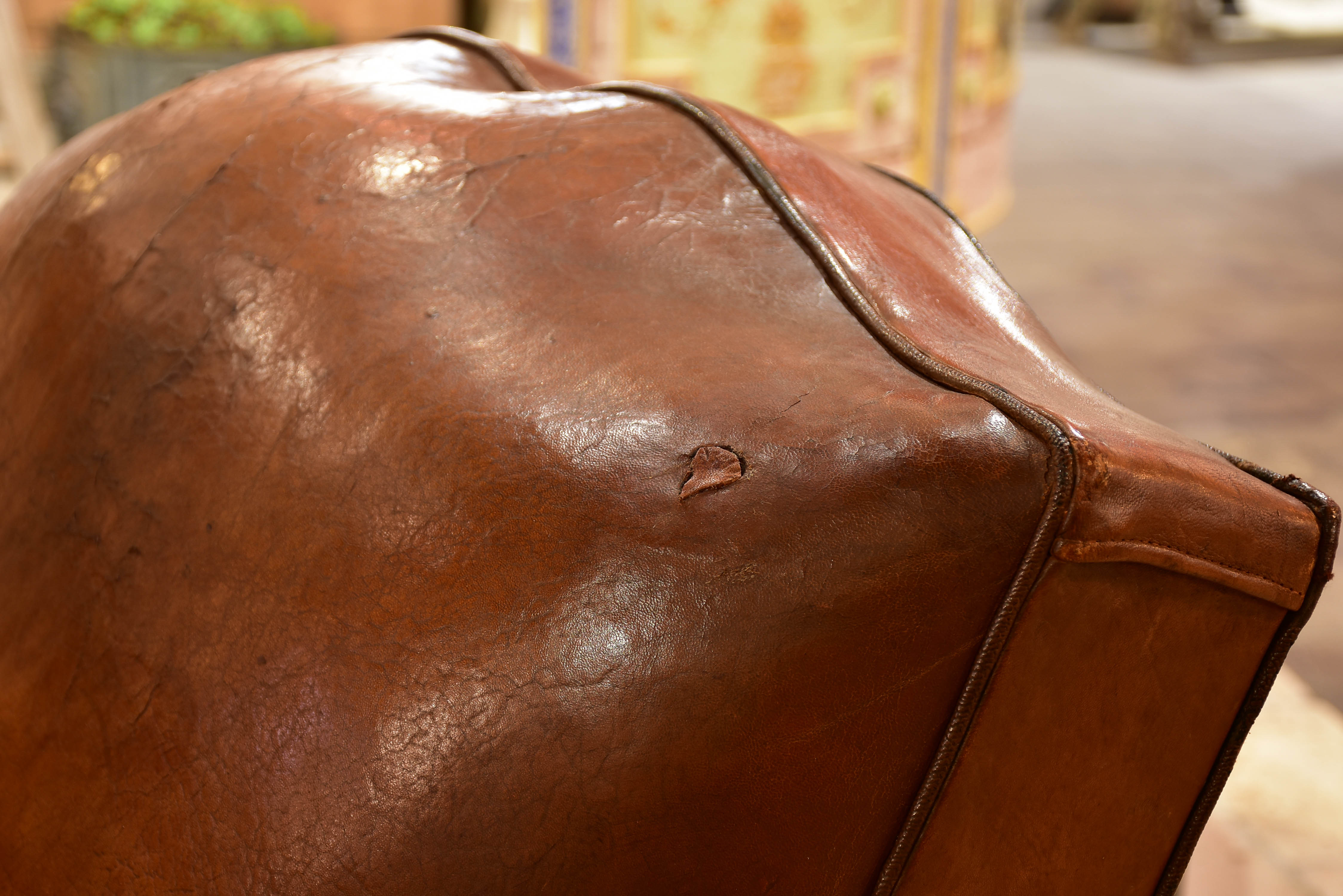 Pair of large moustache back French leather club chairs