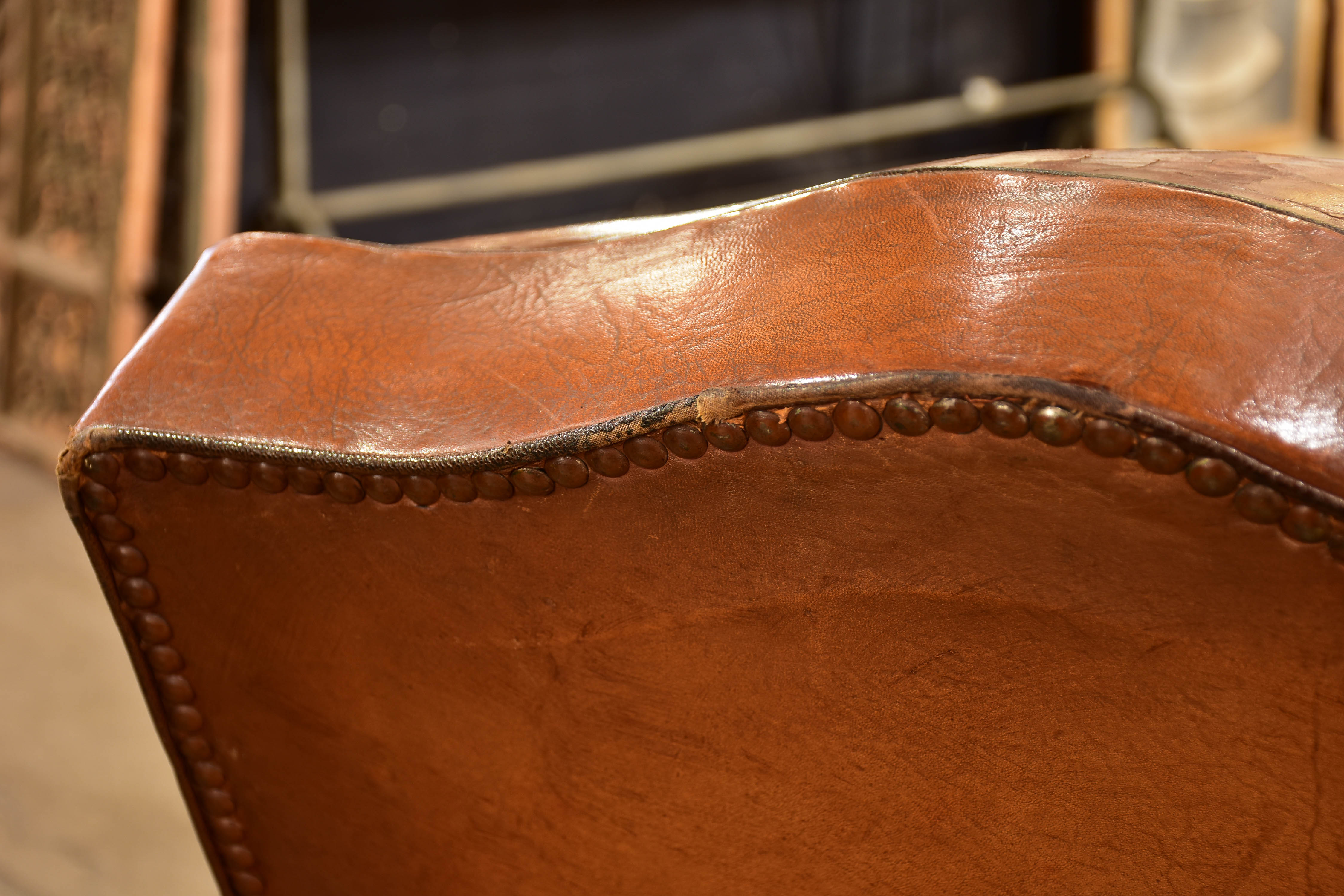 Pair of large moustache back French leather club chairs