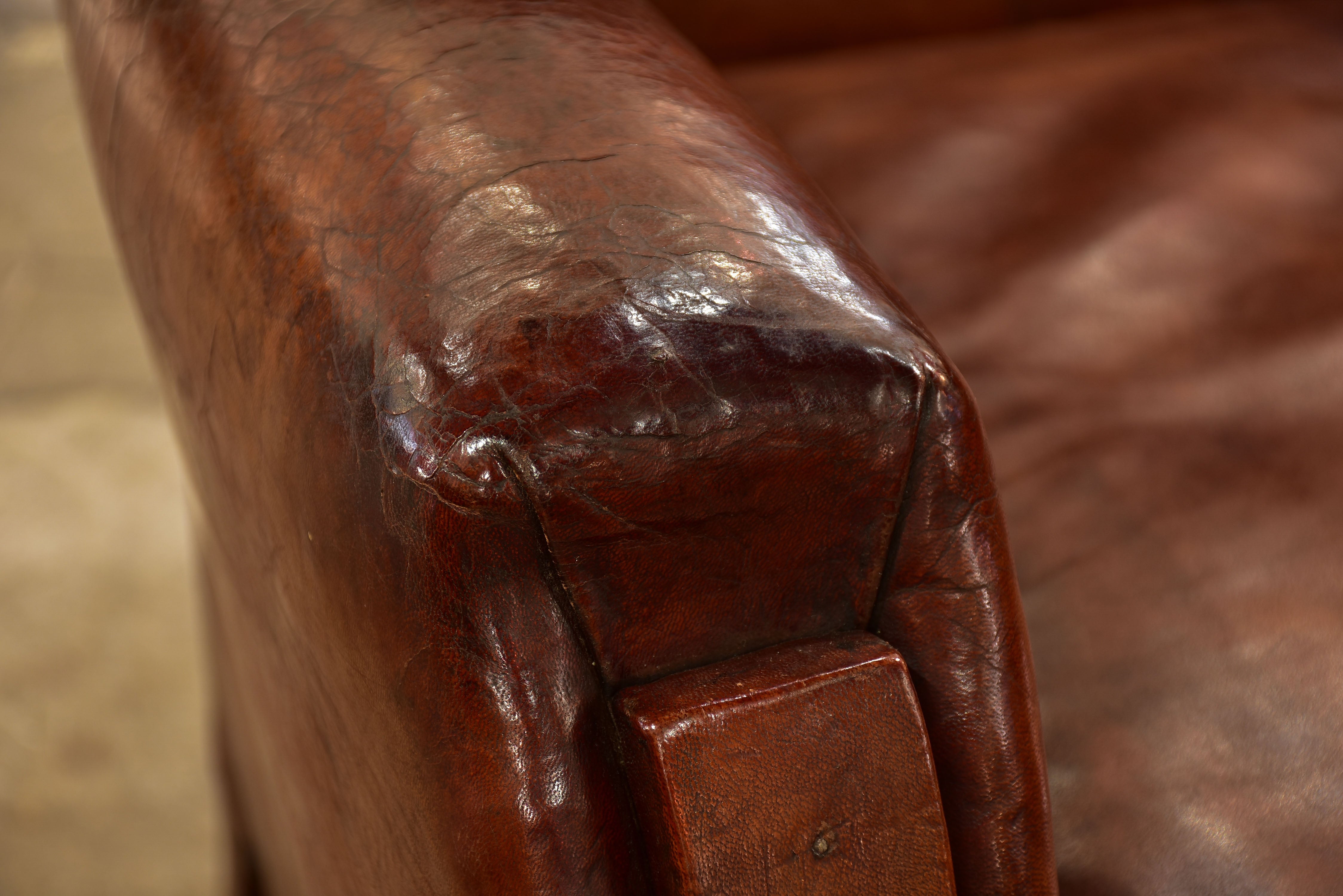 Pair of French leather club chairs from the 1930's with stud detail