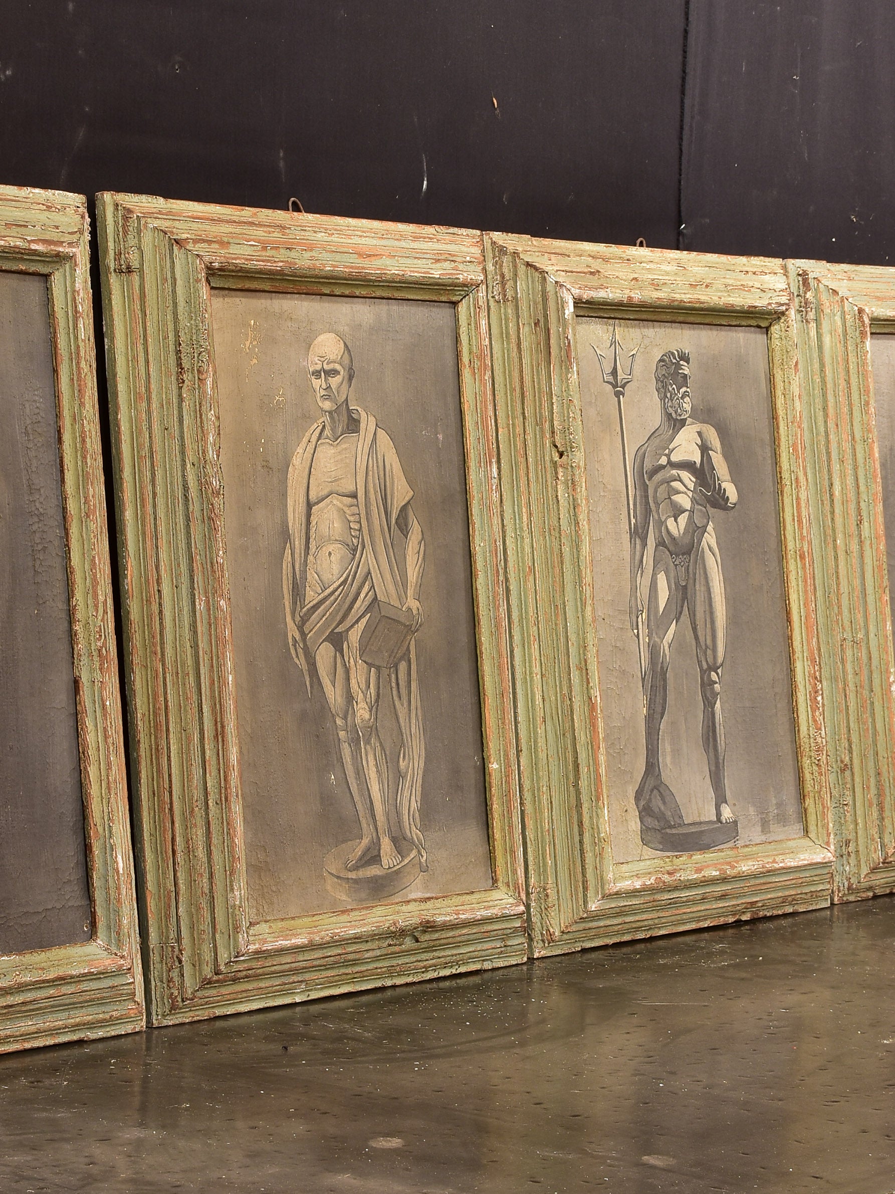 Four framed artworks - statues