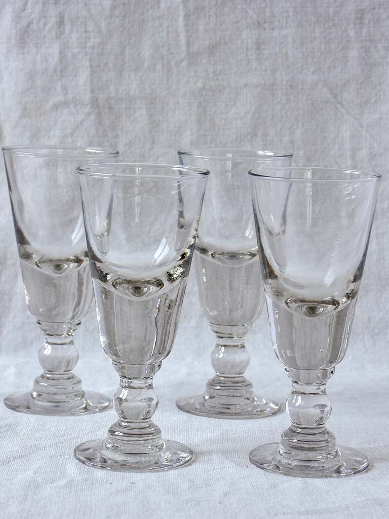 Four late 19th Century French absinthe glasses