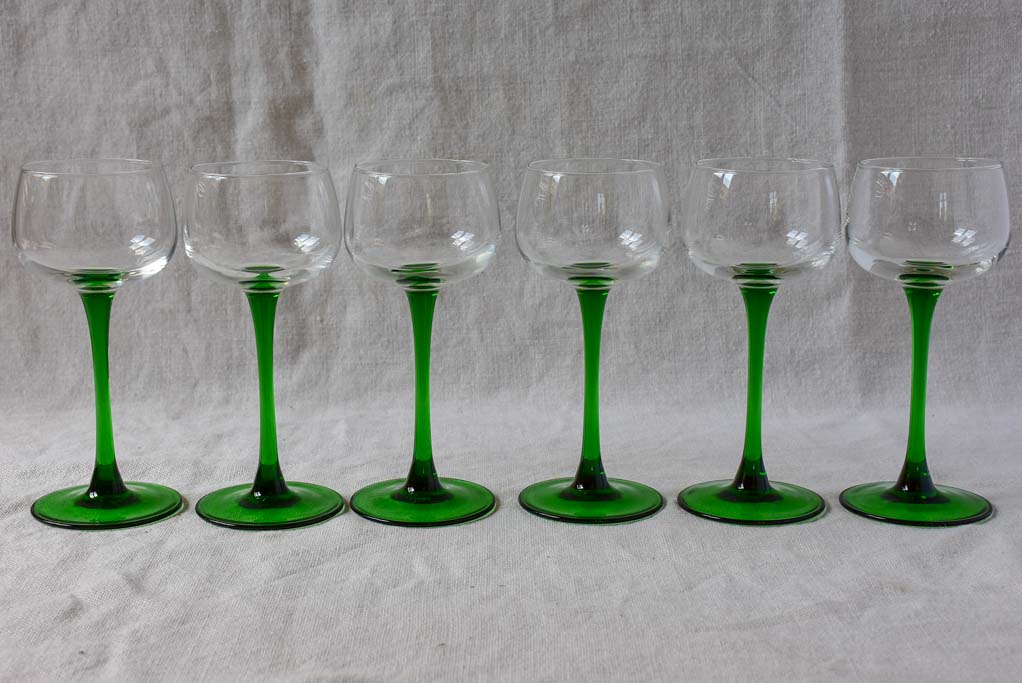 Six vintage Alsatian wine glasses with green stems