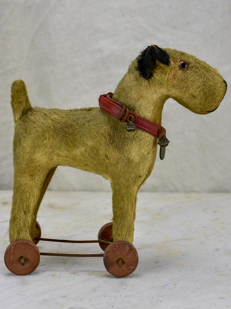 Antique French toy dog on wheels