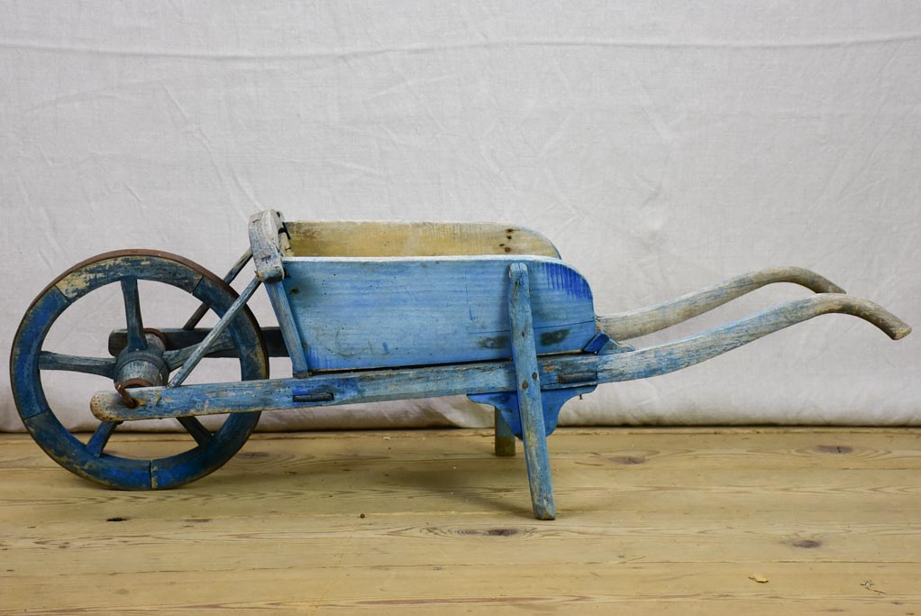 Early 20th Century French children's wheelbarrow with blue patina