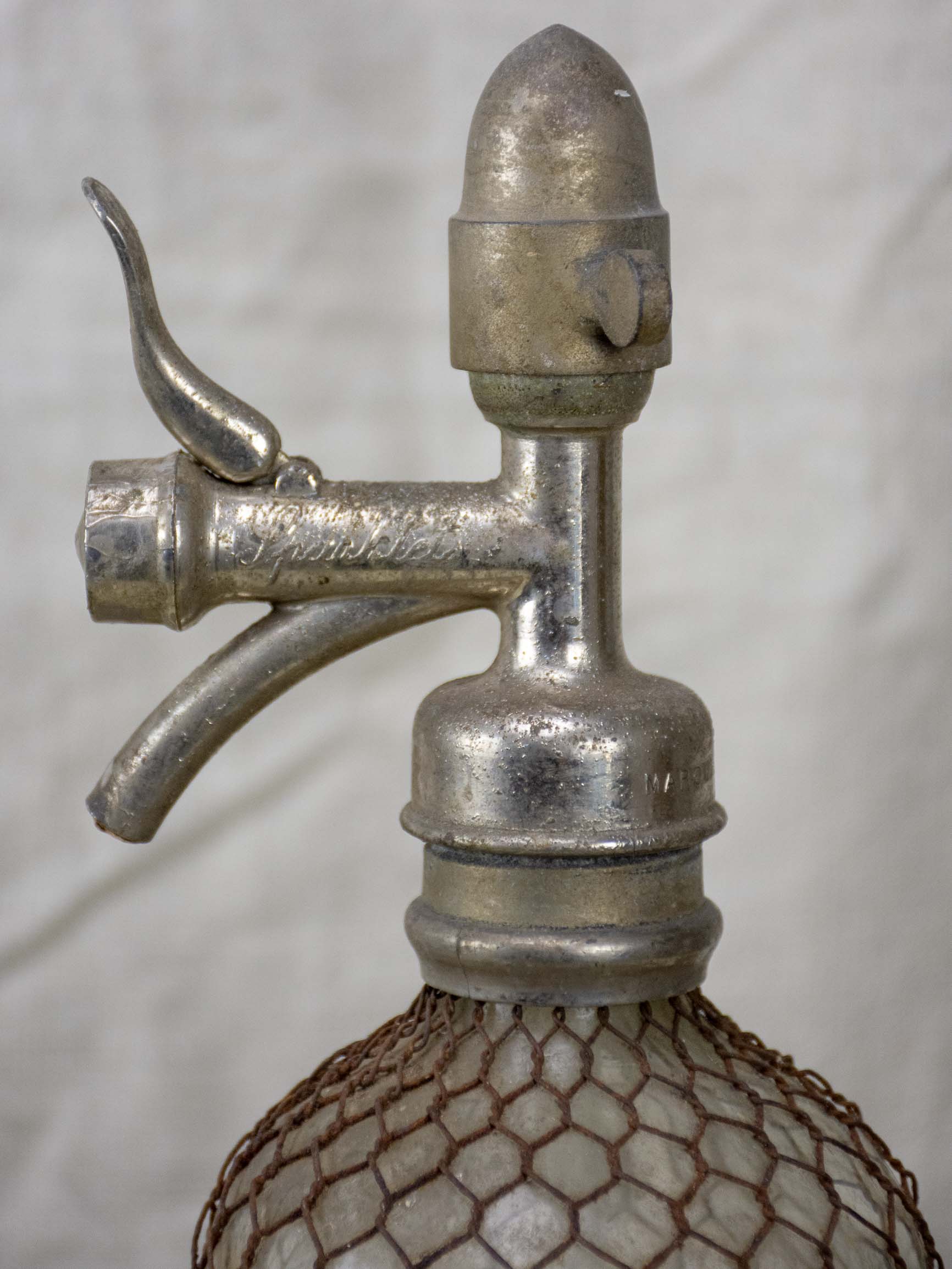 Antique French Sparklets Seltzer bottle with metal wiring