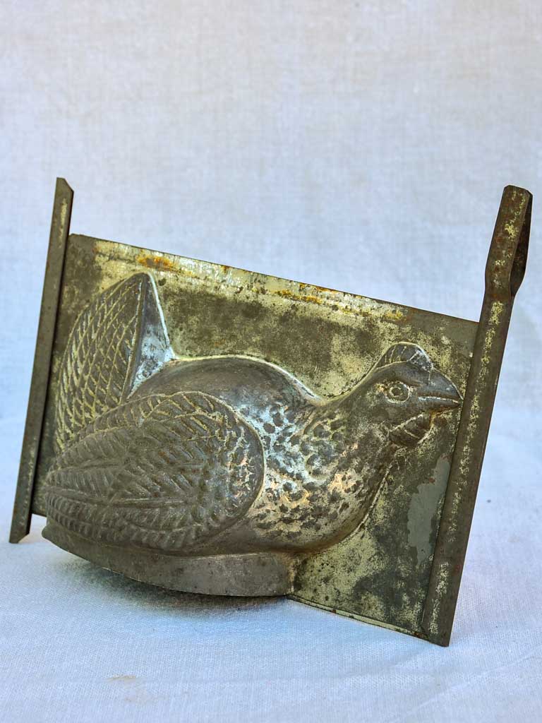 Antique French tin plate chocolate mold in the shape of a chicken