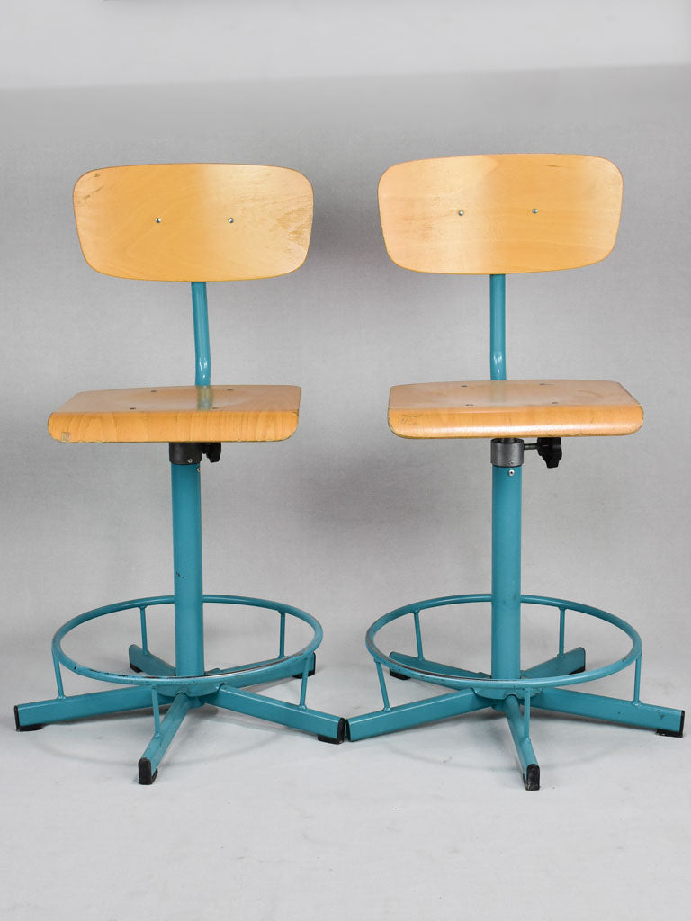 Pair of blue adjustable stools from a Swiss art college