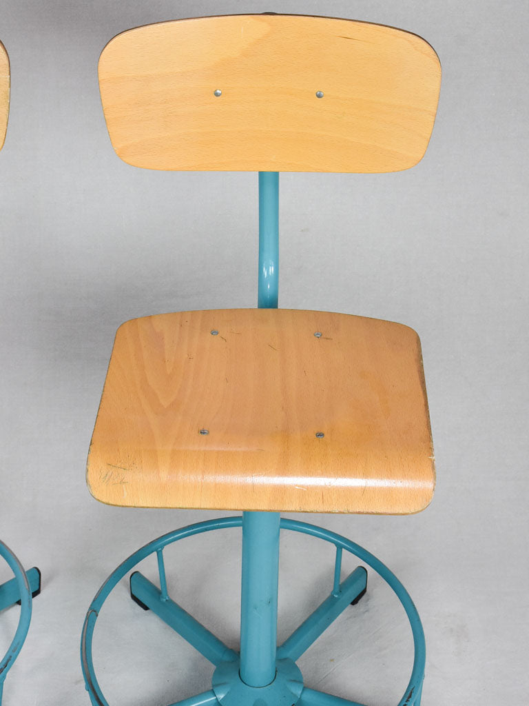 Pair of blue adjustable stools from a Swiss art college