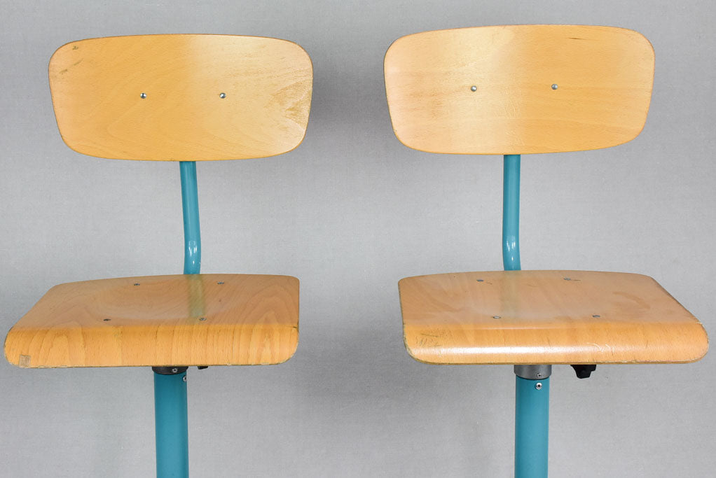 Pair of blue adjustable stools from a Swiss art college