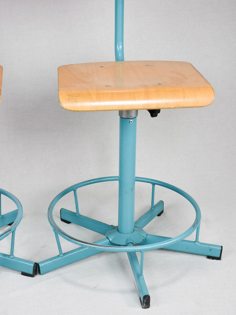 Pair of blue adjustable stools from a Swiss art college