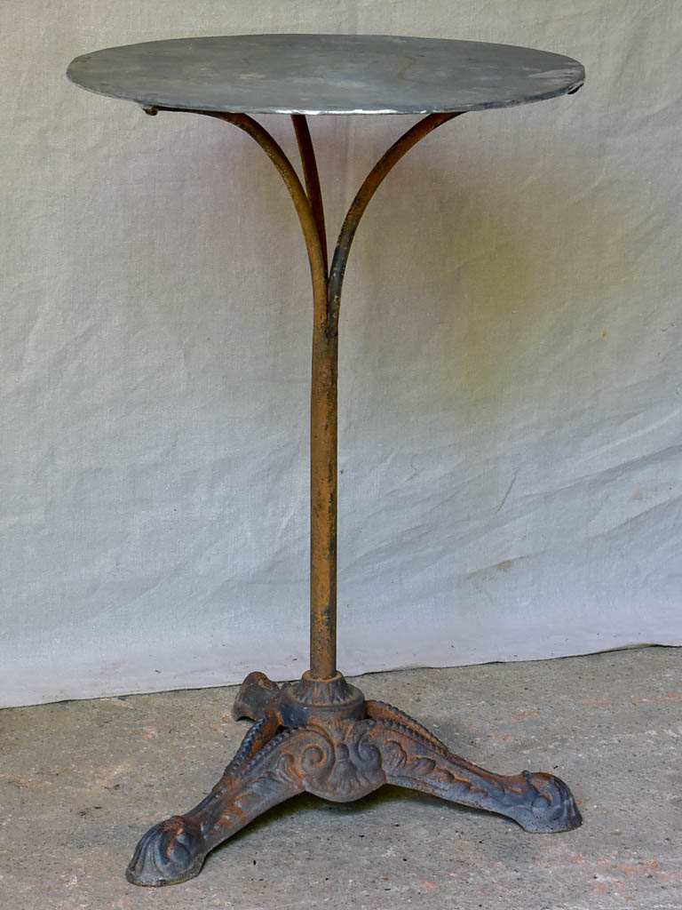 Small antique French bistro table with zinc top and cast iron base