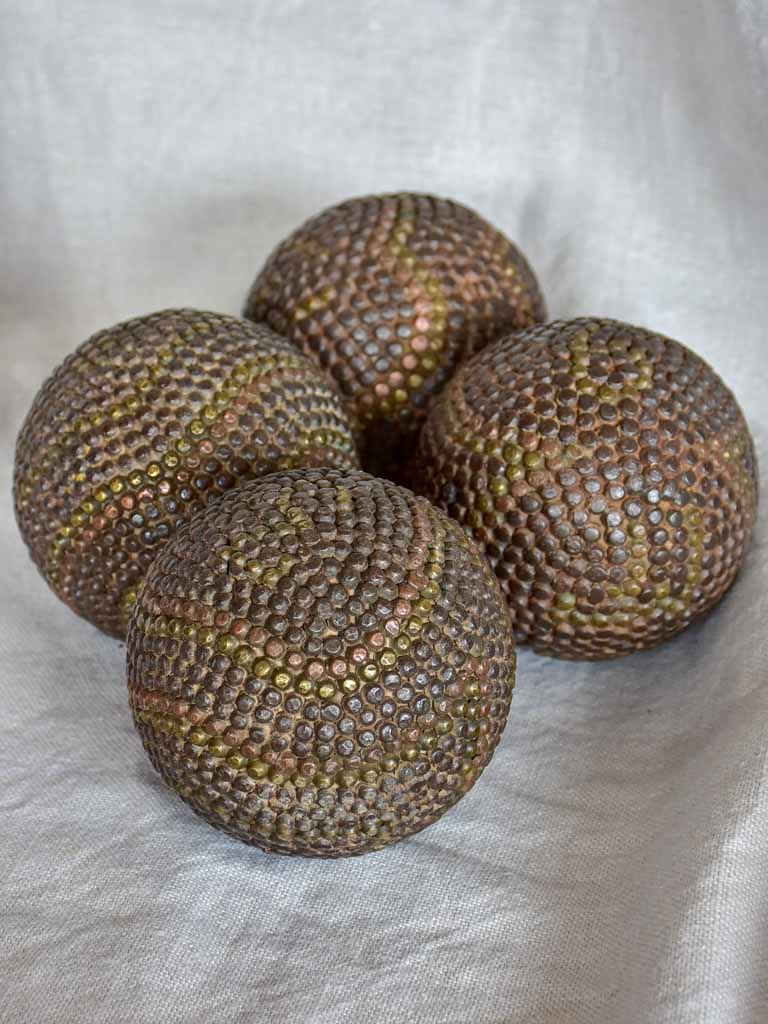 Four antique French petanque balls