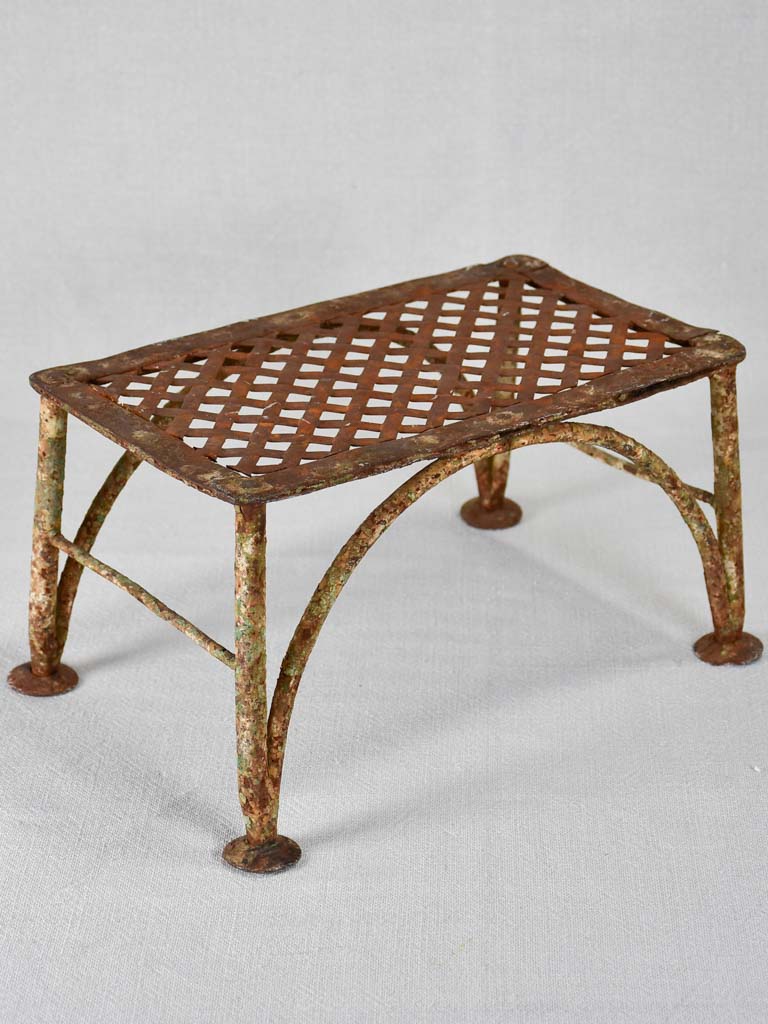 Early-20th-century wrought iron garden foot rest